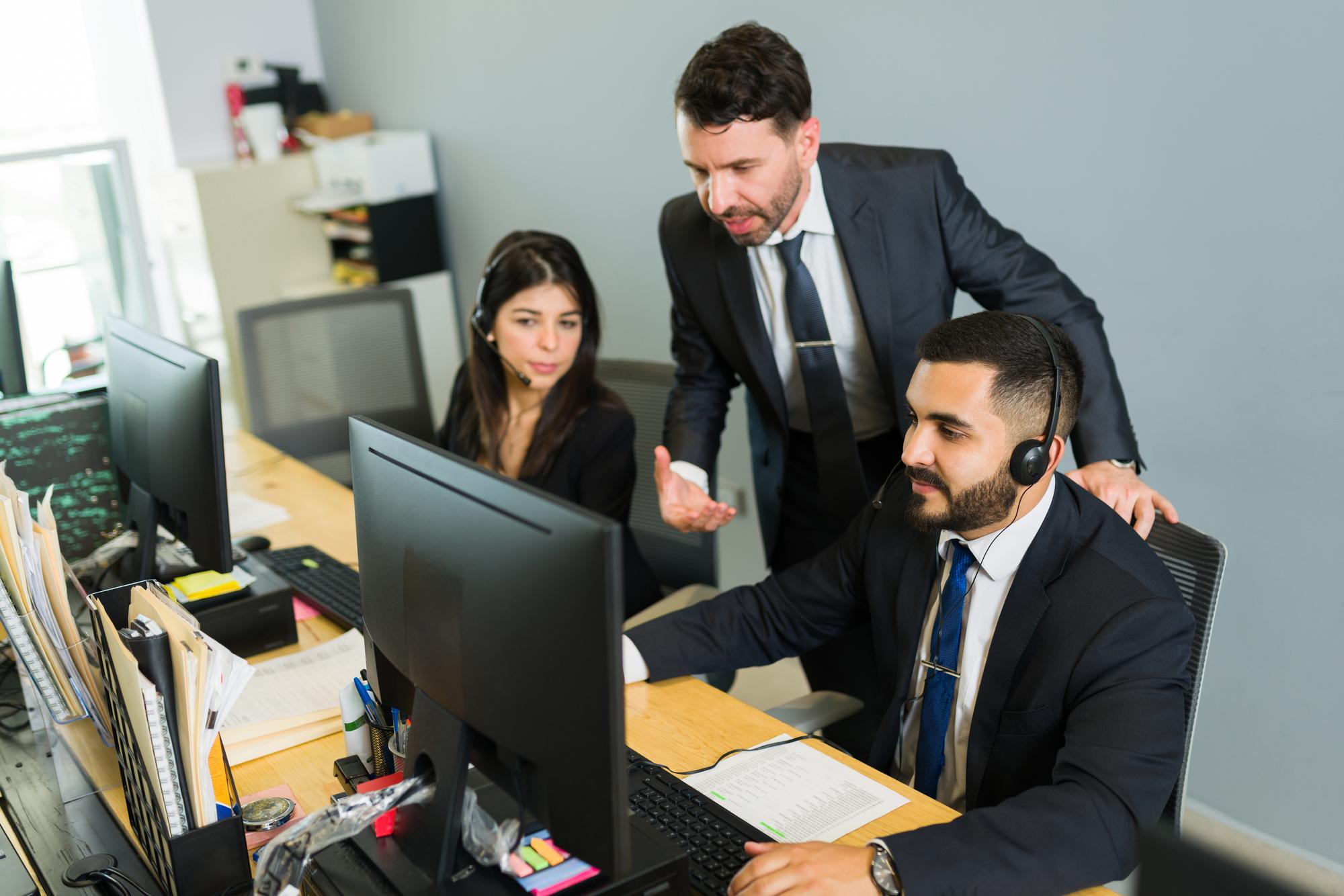 male-supervisor-training-latin-executive-call-center-manager-explaining-work-stuff-employees-offering-tech-support-customer-service